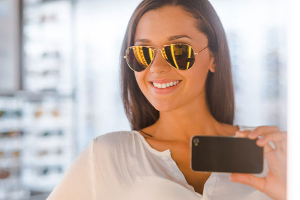 Woman with glasses and phone